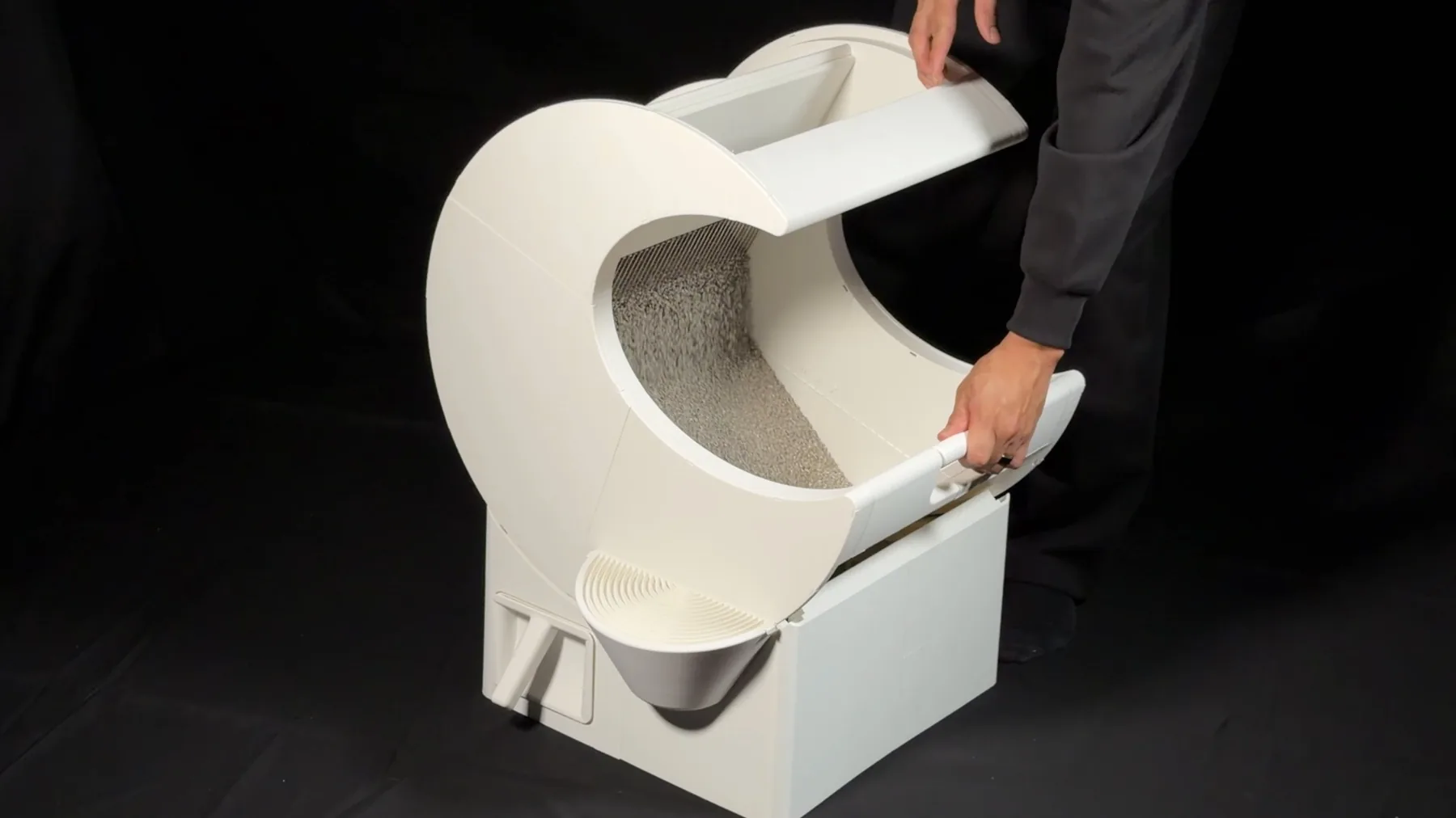 A person rotates MoonBox by hand to begin cleaning